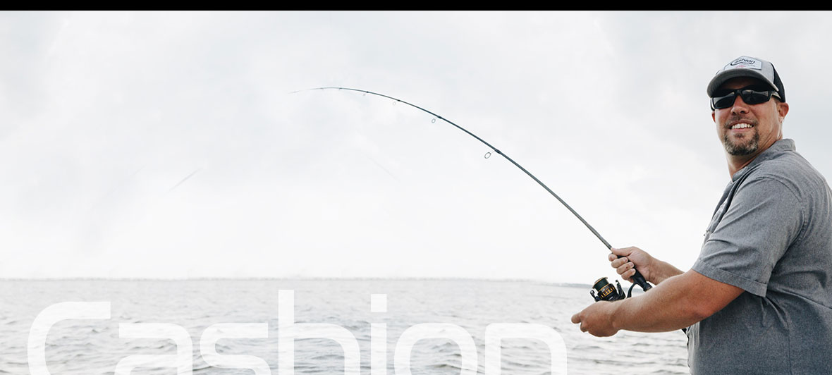 Holding Fishing Rod Photos and Images